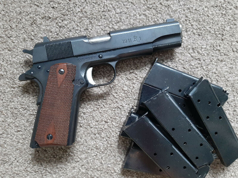 Remington 1911 - R1 in 45 ACP, with slight Holster-wear that can be polished off. Gun never missed a beat and cycles flawlessly. Comes with 7 Mags, ideal for SA