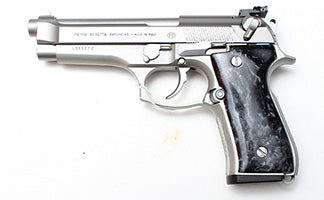 Beretta 92FS INOX 9mm semi-automatic pistol in very good used condition. Features a 125mm stainless steel barrel, satin-finished slide, and anodised alloy frame
