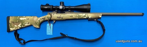 Very good condition Howa 1500 in 308W. Sports a 610mm threaded heavy barrel on a multicam Houge stock. Mounted on a MDT 20MOA rail is an Athlon 8-35x56 scope. H