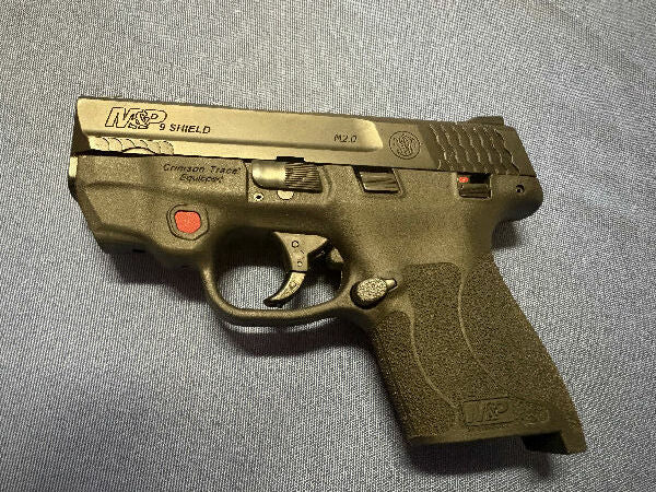 M&P Shield with crimson trace.