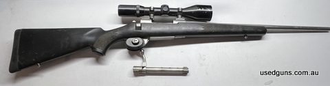 Postage isn't included. Scope has a little damage on eye piece, still works well. Trigger guard not included.