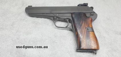 Fitted with adjustable sights and large wooden grips make this firearm an excellent shooter. Comes with 3-8 round magazines. Manufactured in 1953. Typical robus