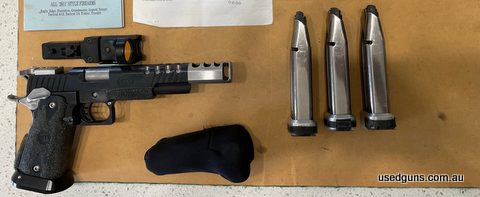 IPSC ready. Side mount C-More (Standard mount included extra), six stainless magazines, match trigger, recoil master, ported barrel. All gunsmithing by ASI.