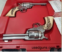 Original consecutively numbered, matched pair of Single Action Shooting Society (SASS) six-shot, five-inch, stainless steel single action revolvers. Slicked act