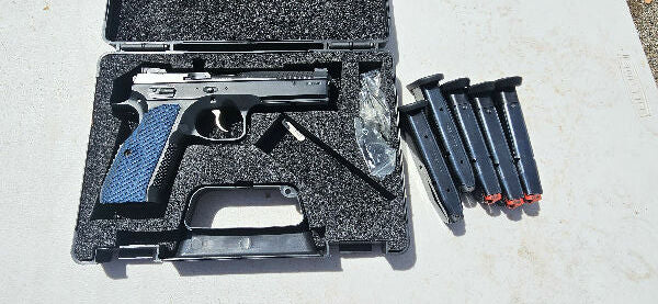 9mm CZ shadow 2 optic ready, currently has iron sights. comes with 5 mags and the hard case.