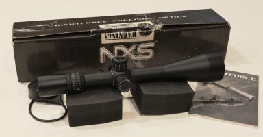 In box with manual, lens covers and lens shade (not shown). Illuminated NP-R2 reticle in second focal plane for ranging and calibrated holdover. (a small piece 