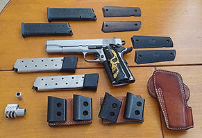 I am selling my Stainless steel 1911 .45 auto...Comes with 2 X 8 round mags and 2x 10 round mags. Hellweg breakfront holster, 2x twin magazine holders, spare st