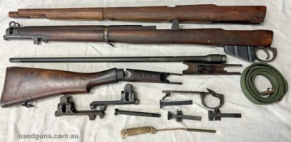 Lots of SMLE bits. Original stock set (rear end has been repaired and glued with Devon like epoxy) plus new old forend plus excellent standard barrel. Windage r