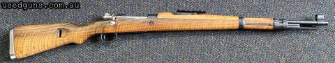 Very good condition Yugo Mauser M48 in 8x57. Has a forward Picatinny rail set up for a scout scope or optic. Lovely tiger stripe stock in excellent condition. M