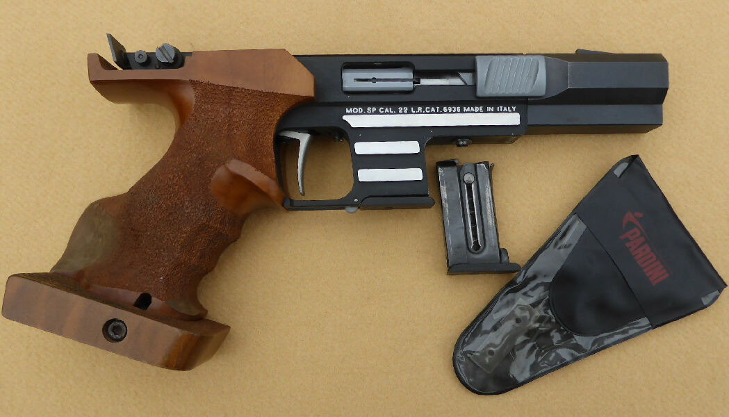 Pardini SP 1st Edition semi auto ISSF .22LR pistol in very good condition.  Comes with RHM grip, 2 magazines, original Pardini tools and hard plastic carry case