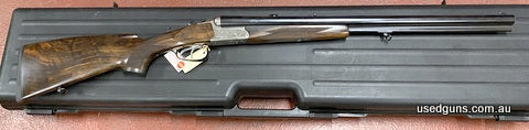 Brand new in box Merkel Drilling 96K 223 / 12G & 12G. Immaculate game scene engraving on the action. Gorgeous dark woodwork with a hogsback comb on the buttstoc