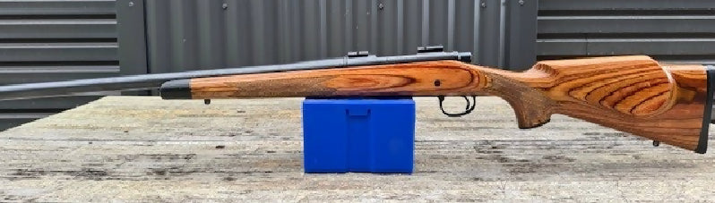 Remington 700 heavy varmint model in 22-250 Rem. Has leupold (weaver style) bases. Comes with a remington plastic stock. Was planning to use action for a custom