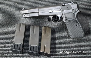 Rare 1981 Browning Hi Power Competition with factory longer barrel, Pachmayr wrap around grip and 50 Gram counterweight to reduce muzzle lift. Pistol in Fair co