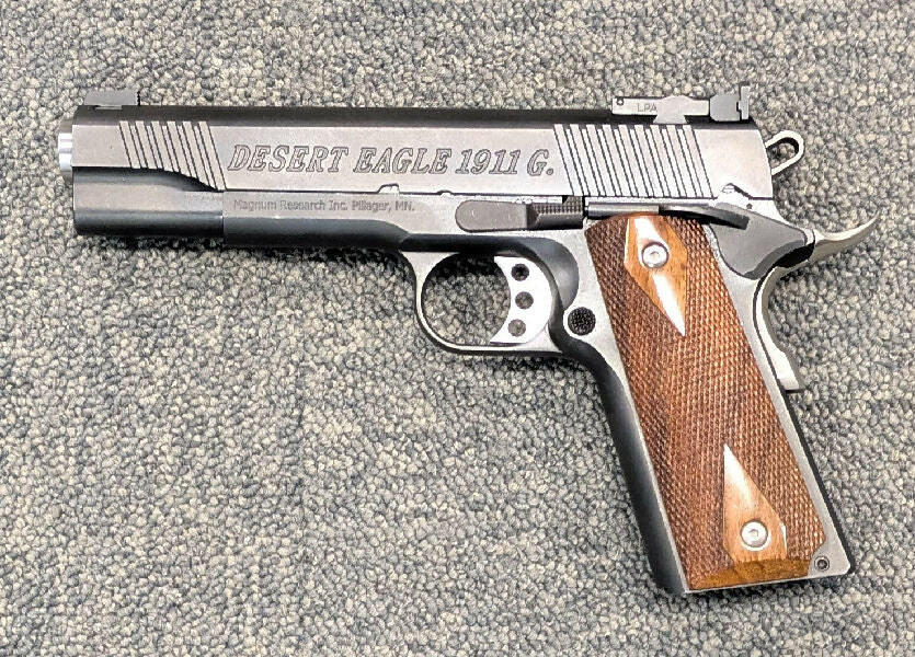 A Magnum Research Desert Eagle 1911 G in 9mm in very good condition. This handgun made by BUL in Israel has a competition barrel, full length steel guide rode &