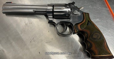 Beautiful comfortable ergonomic Laminated timber grips, 10 shot revolver, better than VG, has dull bluing on trigger. These are around $2k new. will not disappo