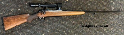 Mauser Oberndorf Sporter in 7x57. Excellent original example. Double set trigger. Hensoldt fixed power scope in edtachable claw mounts. Small chip out of butt p