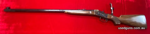 New Pedersoli John Dodine Remington 45-70 Rolling Block rifle. 34 inch ctagonal barrel. Set triggers. Creedmore rear sight tunnel, font sight with elements