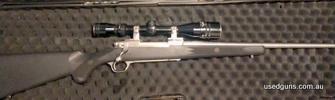 Ruger stainless steel with black synthetic stock. Excellent rifle