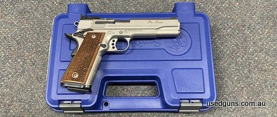 Excellent condition Smith & Wesson 1911 Pro in 9mm. Comes cased with 6 magazines. Cycles excellent. Lovley wood grips. Extended beavertail. $30 freight to your 