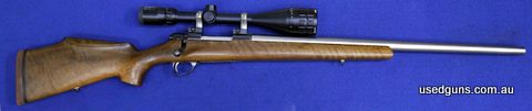 Custom stock, brand new varmint barrel, 22-250 acley improved, internal magazine, hinged floor plate.