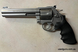 As-new revolver. Comes cased with original engraved wood grips and 6 Jet speed loaders.