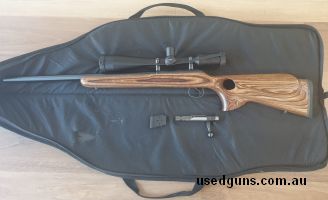 CZ 455 laminated thumbhole stock, unmarked in every way. Has fired less than 200 rounds over bags, only at the range, and consistently produces 8mm or under gro