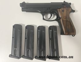 Beretta 92FS in excellent condition with aftermarket Beretta walnut grips and upgraded Beretta stainless steel guide rod and recoil spring.