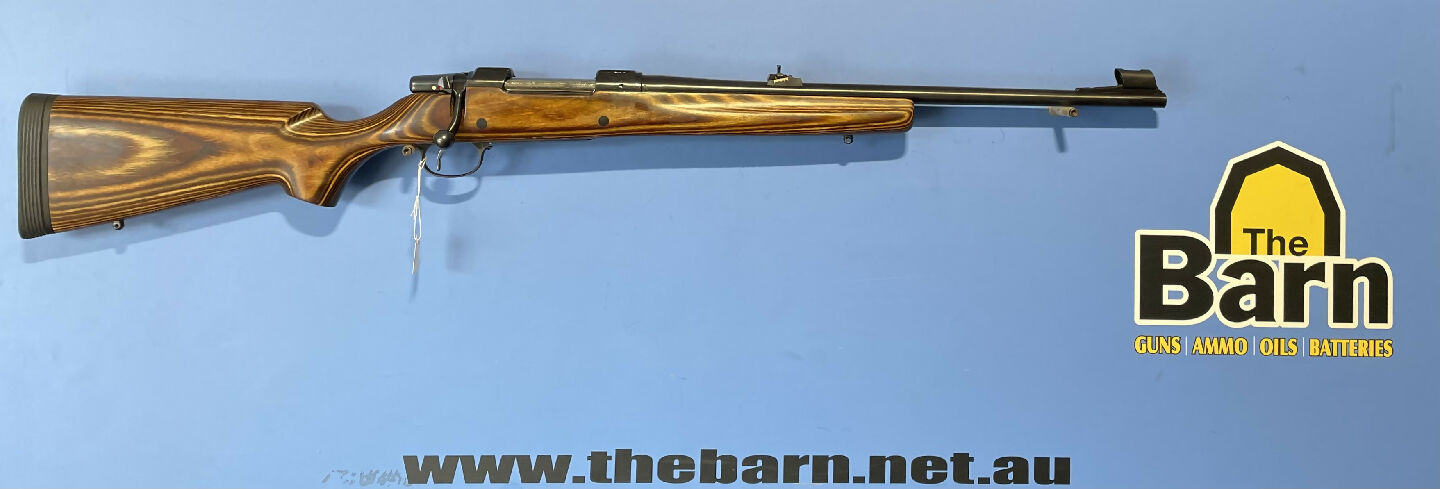 CZ 550 9.3x62. Has open sights, a laminated stock and it is in excellent condition.