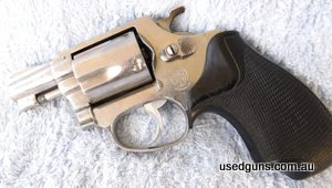 Early model 60 no dash with pinned barrel. After market grips fitted. Has one small corrosion mark on left side frame under the logo otherwise very good to exce