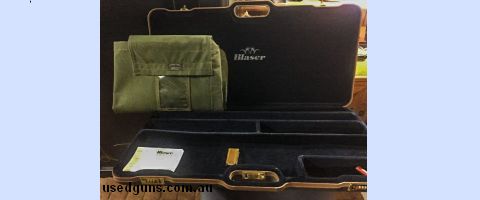 Accommodates : one stock , 2 barrels and 2 scopes , includes 12 gauge custom canvas cover .