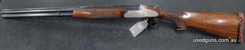 Breda Vega U/O 12G Shotgun in good used condition. The firarm has some beutiful scroll work on the side plated action, 28" barrels, double triggers and ejectors