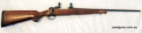 Featherweight model. Nice and smooth control round feed. Stock is in excellent condition. Bluing is complete but does show minor signs of field use. Bolt face i