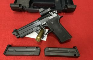 Hi there a very good to excellent beretta 92x in 9mm.  the pistol has not seen much work and comes with a Burris fastfire model 4 scope on top.   make a great c