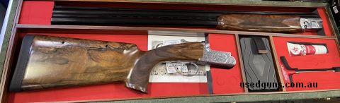 Price drop! Normally $9,200 Yildiz Pro Special Grade 5 Adjustable Stock, 7 chokes, beautiful hard case, single bead. Hand engraved action.