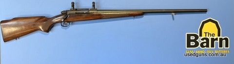 Winchester model 70 Pre 64 243 Varmint. Factory 26 inch varmint barrel, bridge mount has 25mm high rings. Stock has a few bumps and bruises and has a crack that