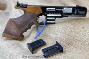 #1034 Cased with spare mag. Note spare mag has a crack in the plastic. I list all my guns as Fair unless they are new, it is up to you to judge what condition t