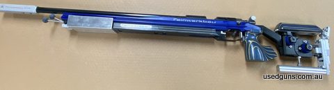 Very good condition Feinwerkbau left handed model 2700 chambered in 22LR. Features an aluminum chassis with a blue laminate timber bottom. Custom bag rider has 