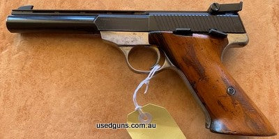 This pistol presents very well and cycles perfectly. It comes with one original magazine and the blued finish is in good condition. The timber grip has some min