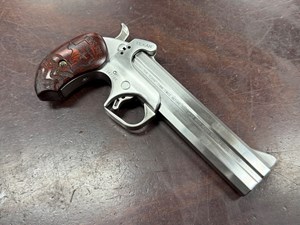 BOND ARMS
TEXAN
45 LONG COLT / 410 GAUGE 
OVER AND UNDER
DERRINGER
6 INCH STAINLESS STEEL BARREL
CHECKERED ROSEWOOD GRIPS
FACTORY ENGRAVED BETWEEN BARRELS
"THE TEXAN THINK TWICE BEFORE
YOU MESS WITH TEXAS" 
#347784

EXC $690