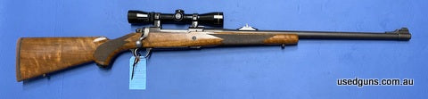Very good condition Ruger M77 chambered in 375 Ruger. Action cycles well, has express sights. Mounted is a Leupold VX-IIc 2-7X scope. Great big game rifle.