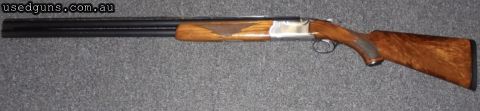 Ruger Red Label Sporting Clays - 30 inch barrels with full set of 5 chokes. Shotgun presents in good condition and certainly not a safe queen. Woodwork has very