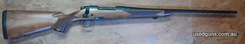 700 Mountain Rifle with engraved detachable magazine, Grey-tan alloy speed lock and spiral fluted bolt. Rifle has been cerokoted of which some has come off. See