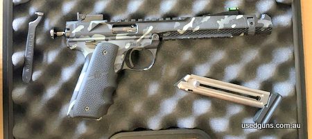 Volquartsen Black Mamba 22LR camo. Cased with 1 x10 shot magazine. 7 inch barrel including compensator. Gun is in very good condition because of a few minor mar