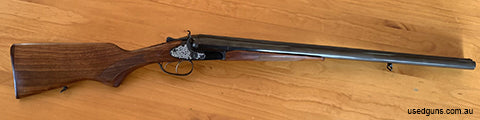Interesting shotgun with external hammers that cock an internal mechanism