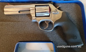 Smith and Wesson 686-6 4 inch barrel 7 months old The pistol has shot less that 500 rounds with low 1.8 grain reloaded ammo. This is a new pistol with next to n