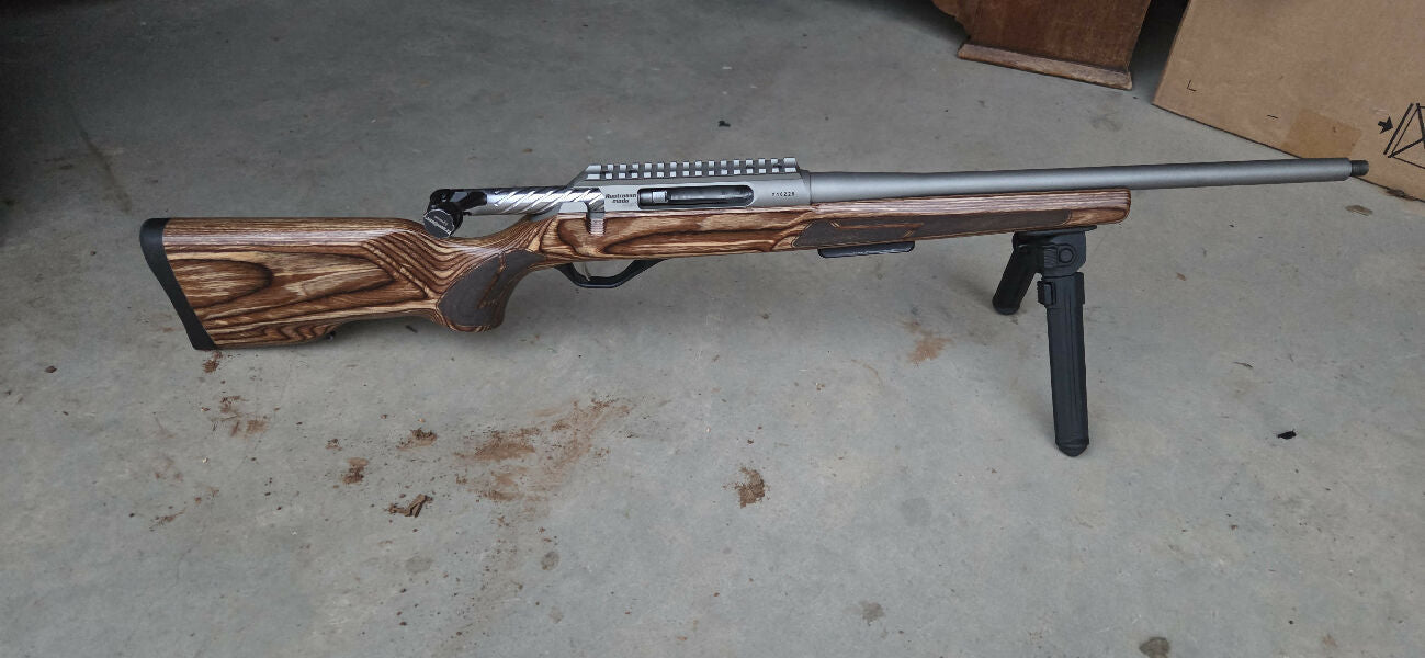 Lithgow LA102 Crossover Laminate Signature Series 223 tatanium edition. In very good condition, does have a few marks on barrel. Fluted bolt. Barrel is 1 in 9" 