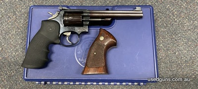 Very good condition Smith & Wesson 14 in 38 Special. Cylinder spins smooth. Has a gunsmith worked wide trigger. Comes with original and rubber grips. Comes case