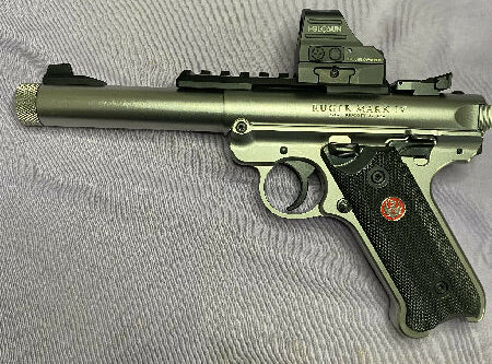Only fired 30 rounds to sight in the Holosun green dot then put away as a safe queen. This pistol and green dot combo is crazy accurate and sits here in mint as