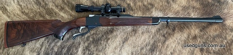 Custom Ruger No1: Late 1970s action, new barrel with barrel band, Express triple leaf open sights and topped with a brand new Leupold 1-4 scope fitted with QD m