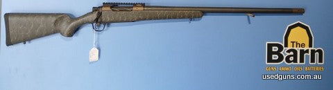 Christensen Arms Ridgeline Bronze in 300 PRC. Is in excellent condition with a Leupold Picatinny rail. Carbon wrapped barrel.